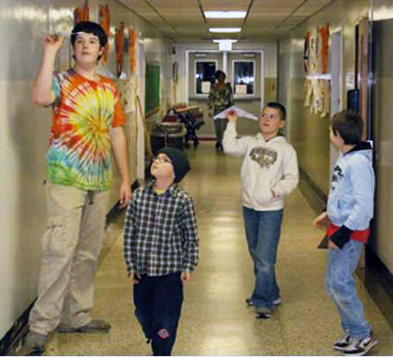 Members of the Indian Lake Central School Paper Airplane Club performing test flights in 2009. Archive Photo of the Day: George DeChant