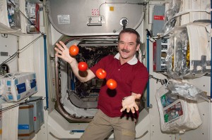Chris Hadfield of the Canadian Space Agency juggles some tomatoes, which he probably considers to be among the more delicious components of a recent "package" that arrived from Earth on March 3. (2013) Source: NASA
