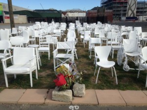 Empty chairs commemorate those  killed in quake. Photo: Tom Vandewater