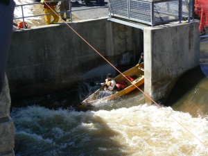 The first canoe to shoot through the sluice way of the Martintown Dam.  Photo by James Morgan
