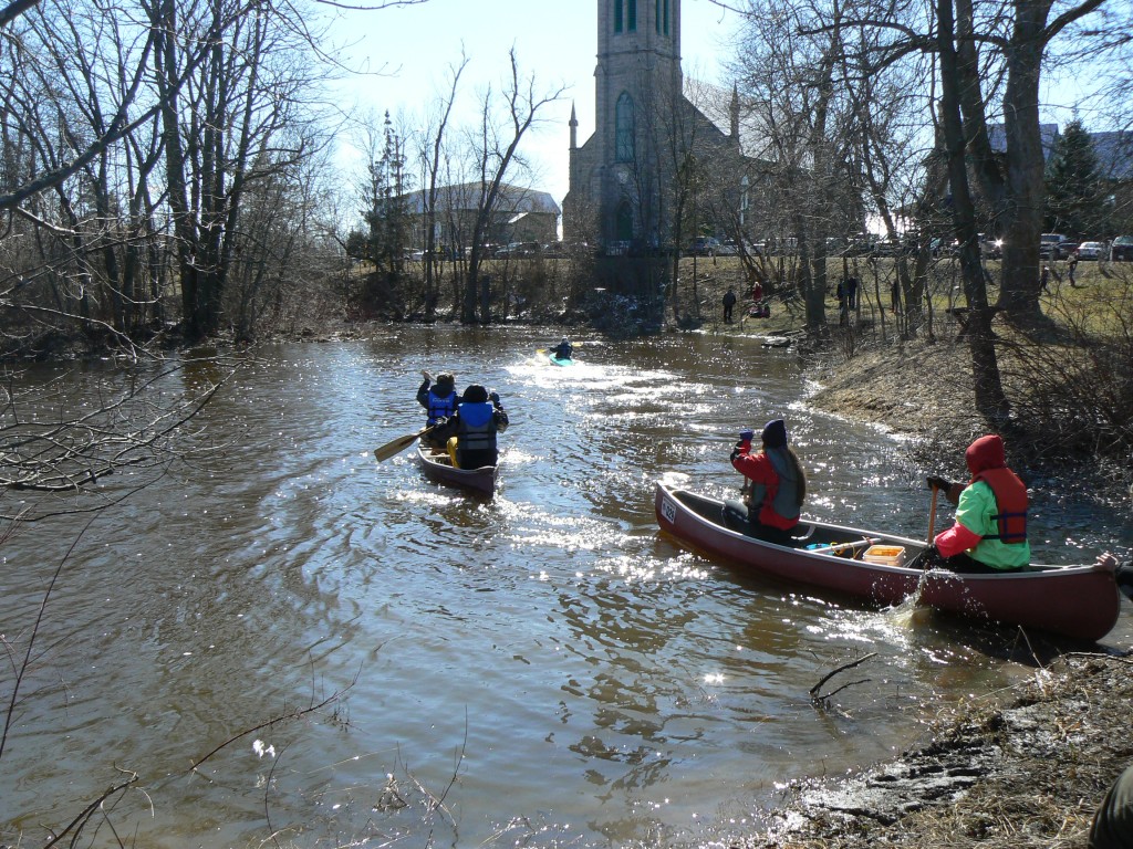 Canoeists begin the Raisin River Canoe Race in St. Andrews, Ontario.  Photo by James Morgan