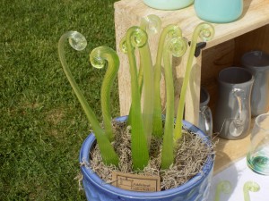 These glass garden row markers shaped like fiddleheads (fern sprouts) are the work of Wakefield glass blower Jennifer Bennett.  Photo by James Morgan