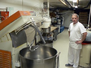 Jay Leroux and a big bread dough mixer. Photo: James Morgan