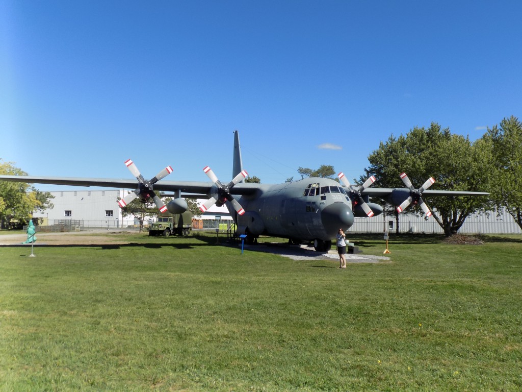 C-130 Hercules 313 at the National Air Force Museum of Canada.  My sister Jessica is standing in front of it.  Photo by James Morgan