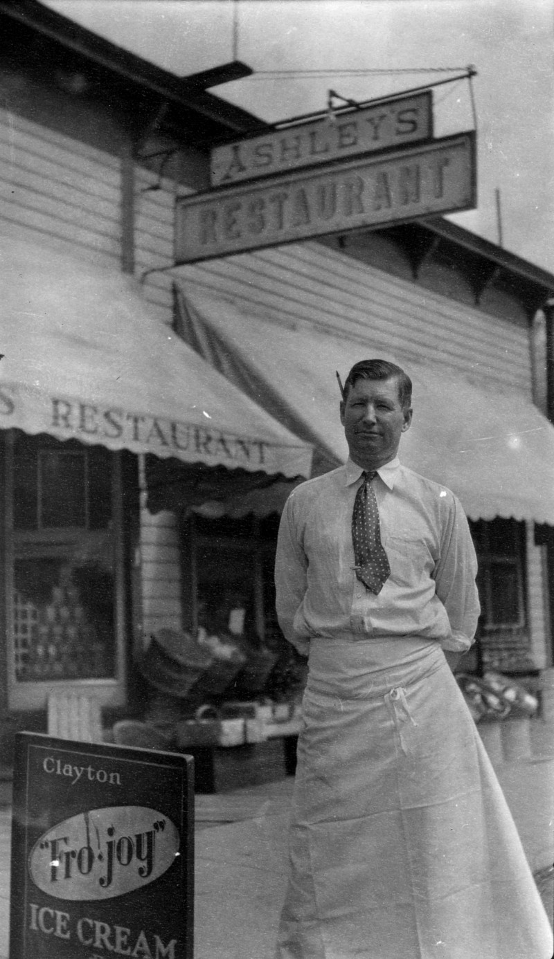 Harley McAllester in front of Ashley's Market and Restaurant on Philadelphia's main street. Circa 1940, Philadelphia, New York. photo: Philadelphia Historical Society Museum