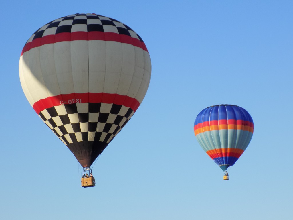 The checkered balloon on the left is from Ontario.  The striped one on the right is from Quebec.  Photo by James Morgan