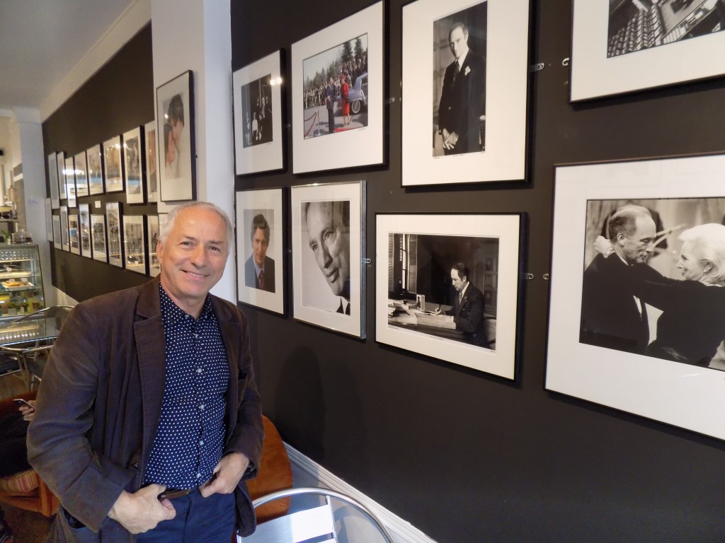 Jean-Marc Carisse and some of his photos of Prime Ministers Pierre and Justin Trudeau.  Photo by James Morgan