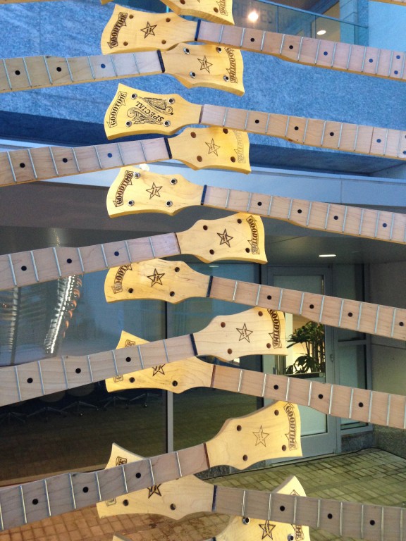 The installation uses discarded/reject banjo parts from Deering Banjos.