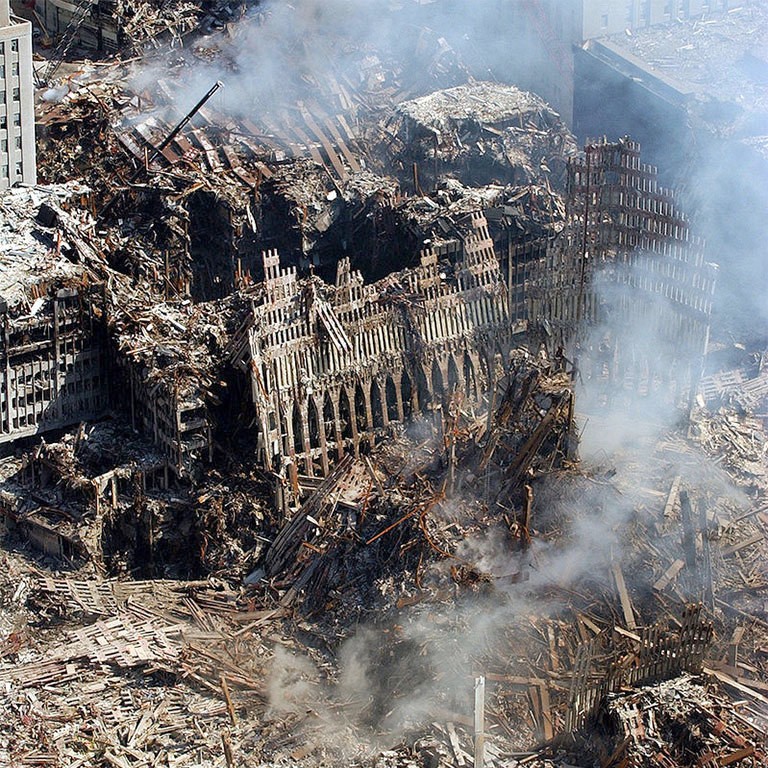 Ruins of the World Trade Center, 9/17/01. More than 3,000 children lost a parent in the 9/11 attacks. Photo: Chief Photographer's Mate Eric J. Tilford, U.S. Navy, public domain