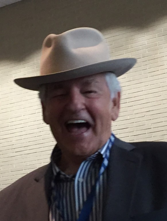 That's Del McCoury, trying on Leigh Gibson's hat.