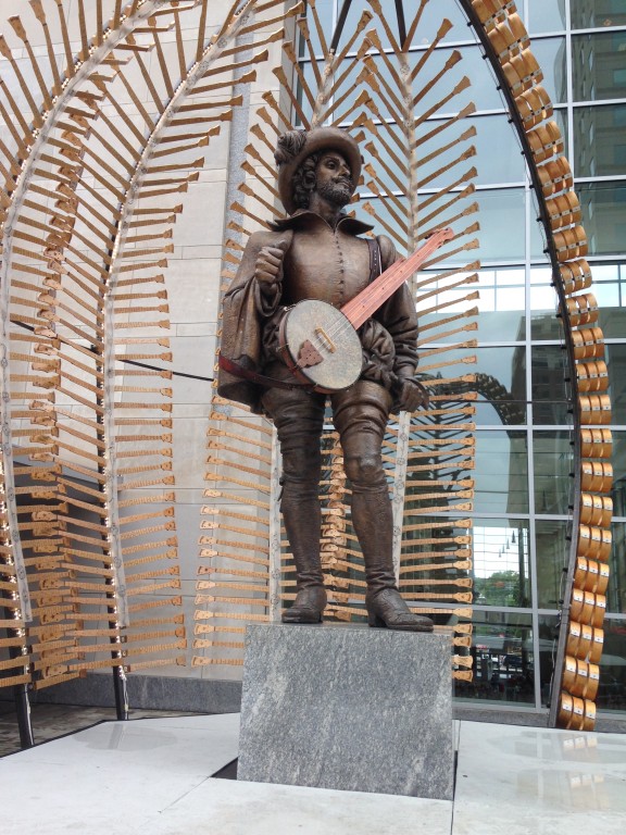 Sir Walter Raleigh towers outside the convention center, sporting a backdrop of banjo parts, and slinging his own larger-than-life banjo.