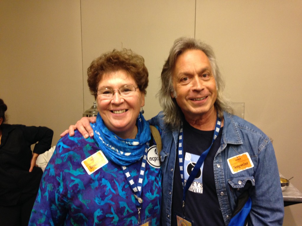 That's me (L) with Jim Lauderdale.  We're at a DJ/artist meet & greet event.  My tag says "Broadcaster".  Jim's says "Songwriter". We both say cheese.