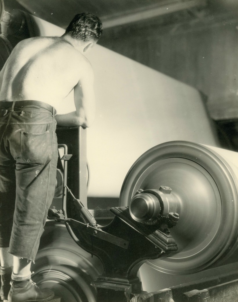 Man working the rollers shirtless.