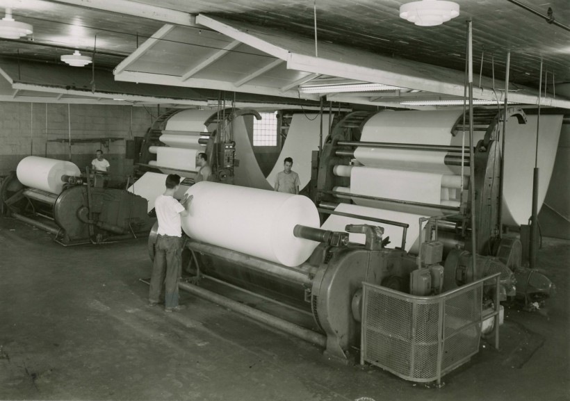 Operating paper roll machinery.