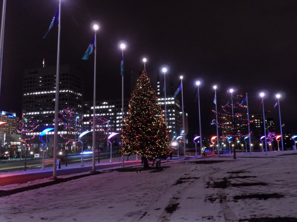 Lights in front of City Hall contrast with the evening urban landscape along Laurier Avenue.  Photo: James Morgan