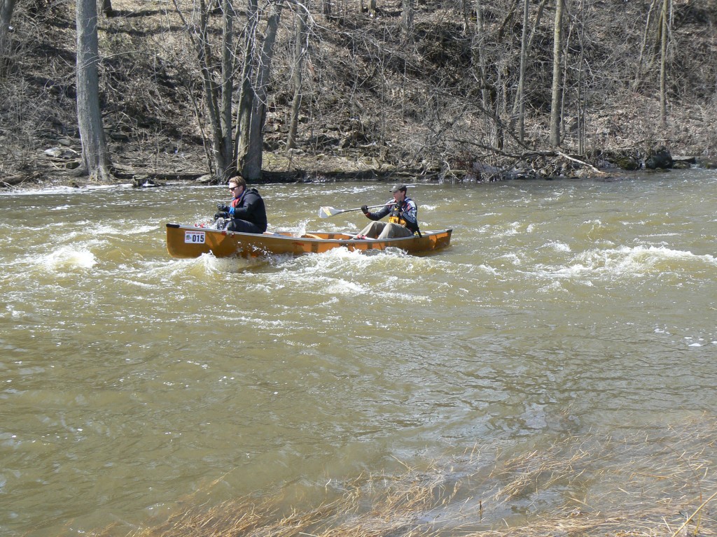 Adam Woolfrey and Scott Reynolds were the first across the finish line in the Raisin River Canoe Race.  Photo by James Morgan