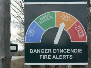 A wildfire hazard sign in Gatineau Park, Quebec.  The hazard there is high right now, after a few weeks of dry weather.  It's cause for concern with the major wildfire going on in Alberta at the same time.  Photo by James Morgan