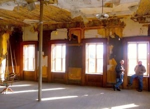 Heuvelton Historical Society members John Danis and Dave Kingsley chat on the unrestored third floor of Pickens Hall last year. Photo: Todd Moe