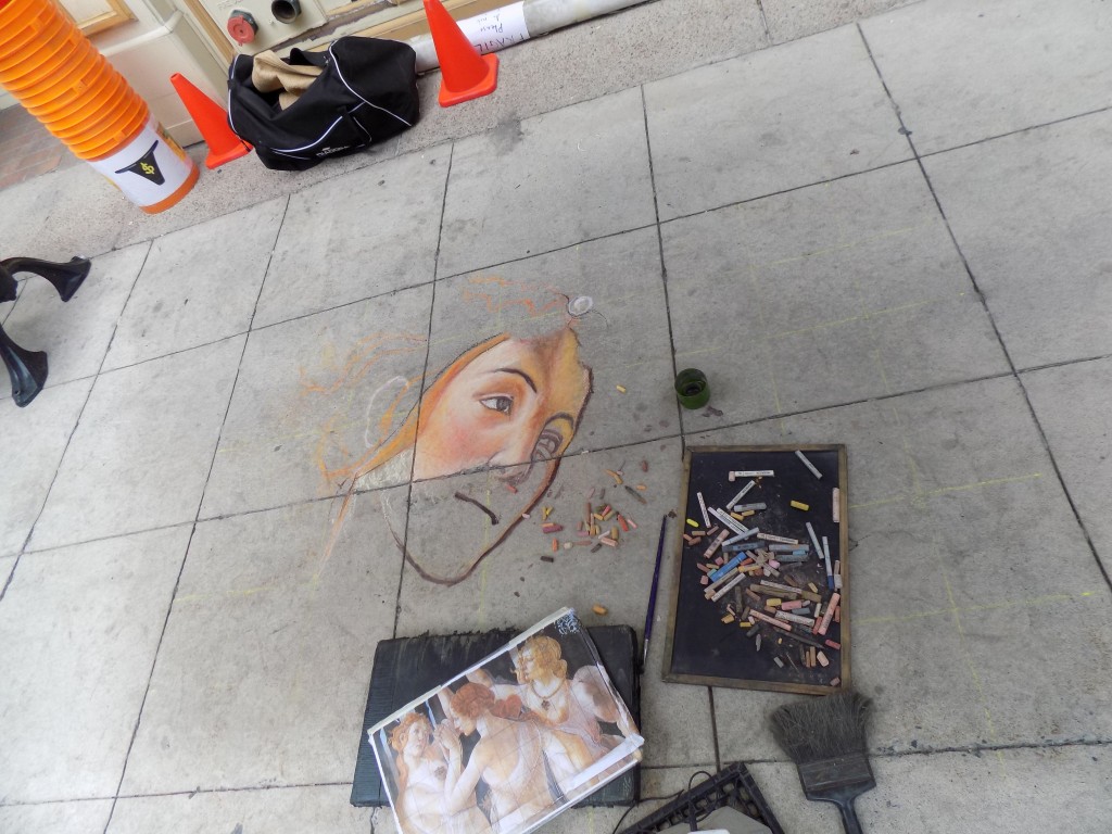 Busking isn't all song and dance.  This is no ordinary sidewalk drawing.  Photo by James Morgan