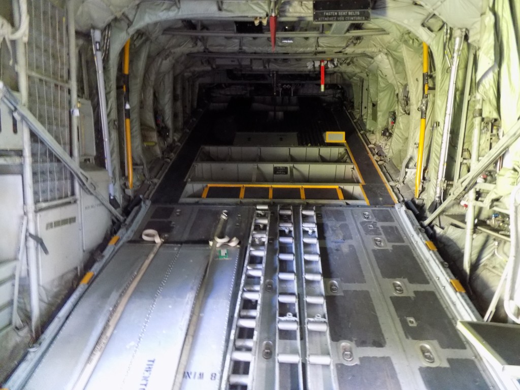 The cargo hold and ramp at the rear of C-130 313.  The RCAF has been using various models of the aircraft since 1960.  They are used to carry everything from soldiers to vehicles and goods for humanitarian relief.  Photo by James Morgan