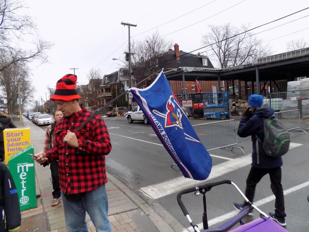An Ottawa Roughriders fan flies a flag from the past.  The Roughriders were Ottawa's pro football team from 1876 to 1996 and won the Grey Cup nine times.  Photo: James Morgan