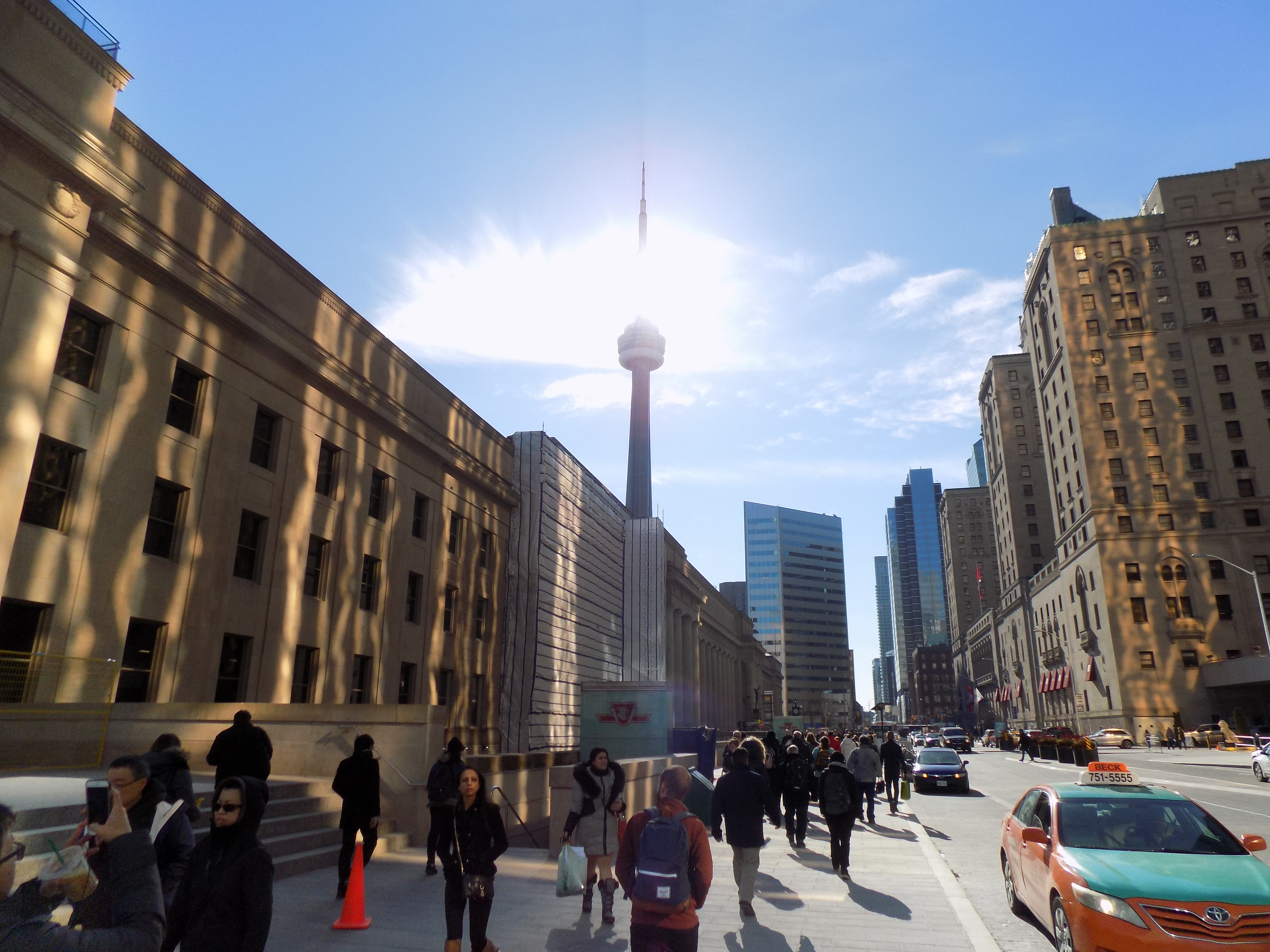 Union Station in Toronto on the left with the CN Tower reaching for the sun in the background.  The Royal York Hotel is on the right.  Photo: James Morgan