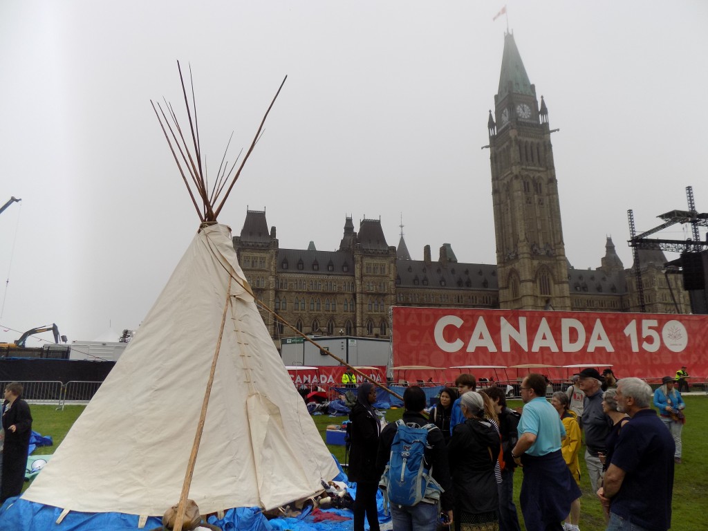 Indigenous activists put up the teepee on Parliament Hill on Wednesday evening and there was a brief skirmish with law enforcement.  Canada Day is not a celebration for everyone.  Prime Minister Trudeau visited the teepee and spoke with the occupants on Friday morning.  Photo: James Morgan