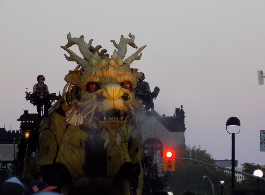 The dragon approaching the Mackenzie King Bridge with the University of Ottawa campus in the background.  Photo: James Morgan