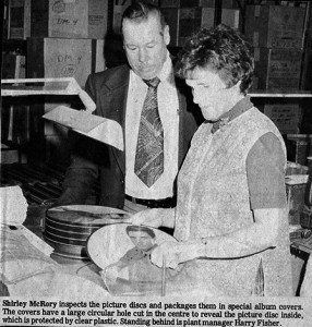 Employee Shirley McRory is seen here inspecting picture discs with plant manager Harry Fisher. Smiths Falls Record-News photo, courtesy of Smiths Falls Heritage House Museum.