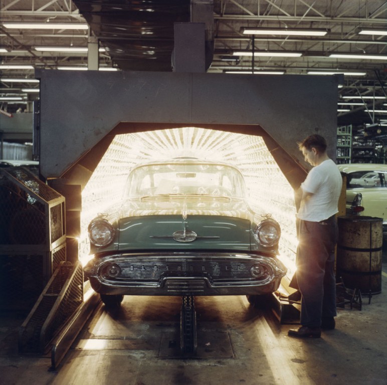 A freshly painted Oldsmobile rolls off the General Motors assembly line in Oshawa, Ontario in 1959.  There is a long history of Canadian connection to the US auto industry.  Photo by Herb Taylor.  Library and Archives Canada, National Film Board of Canada R1196-14-7-E