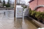 Saranac River pushes into the business district (Photo:  Brian Mann)