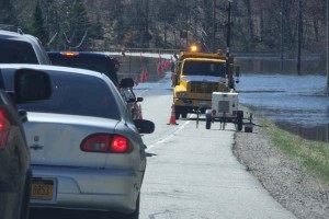 Rt. 3 between Saranac Lake and Tupper Lake was reduced to one flooded lane on Saturday.  (Photo:  Brian Mann)
