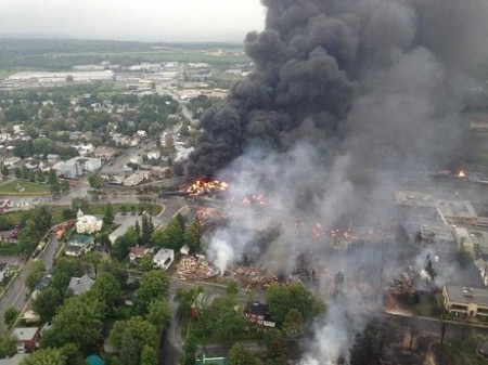 Lac-Megantic burning on the first day after the rail car derailment sent fireballs and streams of burning oil coursing through the Quebec village. Photo: Surete du Quebec