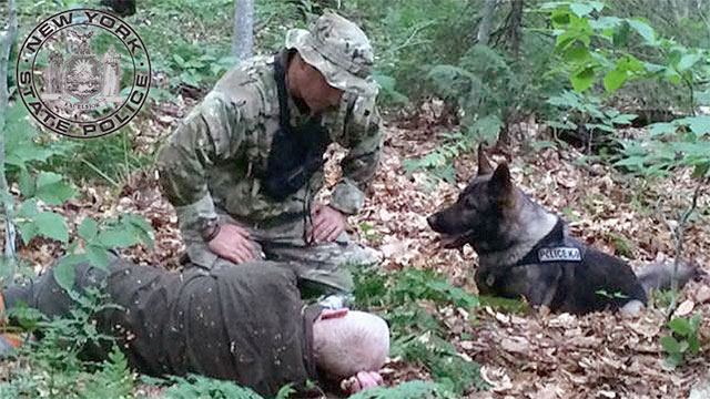 Trooper Mark Bender and his K-9 dog Mandin with 84-year-old Donald Combs. Photo: NYS Police